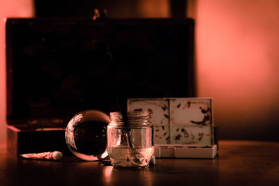 Close-up of glass jar on table