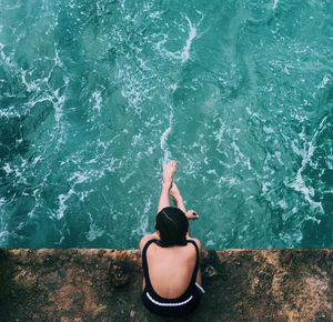 Rear view of woman looking at sea