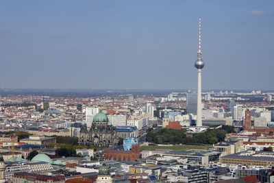 Communications tower and cityscape