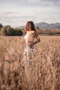 Woman standing on field