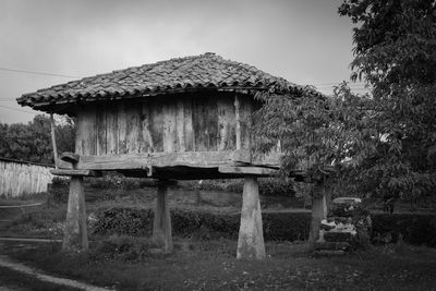 Wooden structure on grassy field