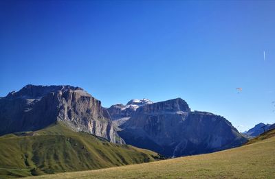 Scenic view of mountains against clear blue sky