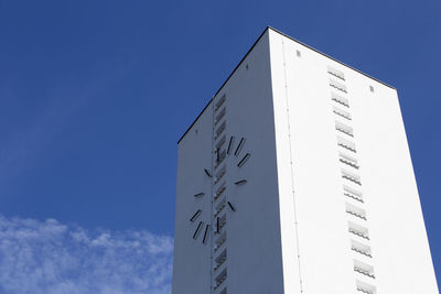 Low angle view of building against blue sky