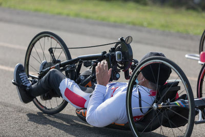 Man riding bicycle on road