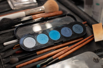 High angle view of paintbrushes on table