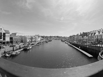 High angle view of river amidst buildings in city