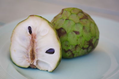 Close-up of fruits in plate on table