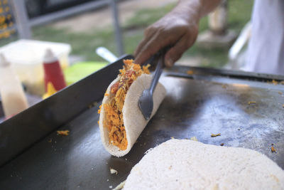 Close-up of hand holding food