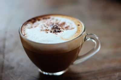 Close-up of cappuccino on table