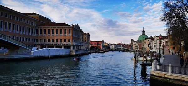 Canal passing through city buildings