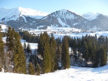 Scenic view of snowcapped mountains against sky