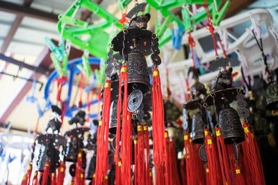 Close-up of multi colored decorations hanging for sale