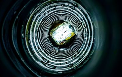 Directly above shot of spiral seen through hole