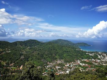 Scenic view of sea and mountains against sky