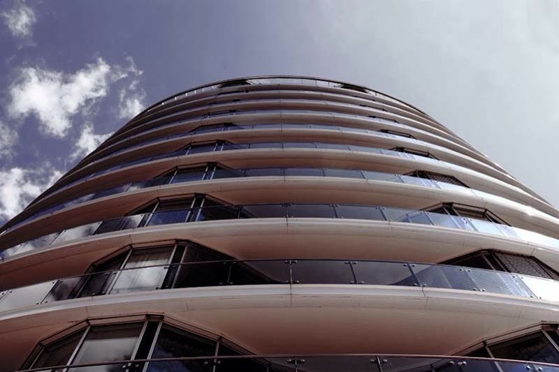 architecture, low angle view, built structure, building exterior, modern, sky, glass - material, office building, building, window, city, reflection, tall - high, skyscraper, day, cloud - sky, outdoors, no people, cloud, repetition