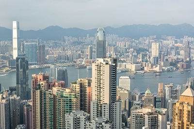 Aerial view of city and buildings against sky