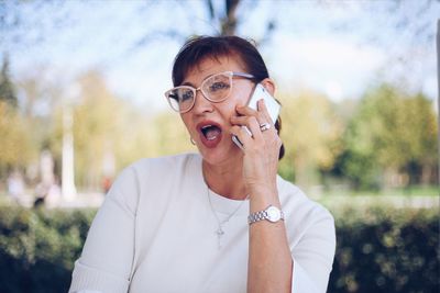 Close-up of mature woman talking on mobile phone