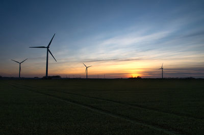 Scenic view of field against sky during sunset