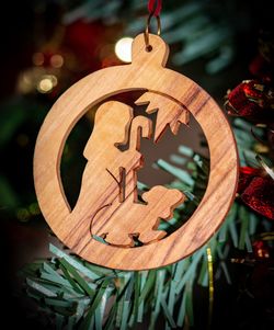 Close-up of christmas decorations hanging on tree