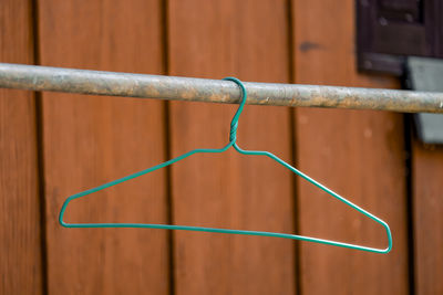 Close-up of metal fence against wall