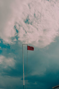 Low angle view of flag against sky