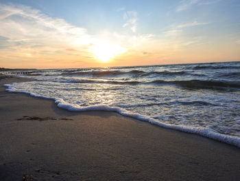 Scenic view of sea against sky during sunset