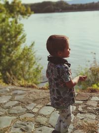 Cute boy standing in lake