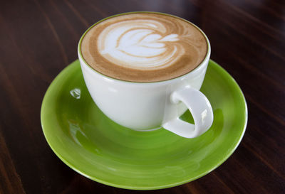 High angle view of cappuccino on table