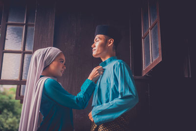 Young couple looking at camera