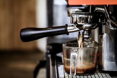 Close-up of coffee served on table in cafe