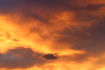 Low angle view of dramatic sky during sunset