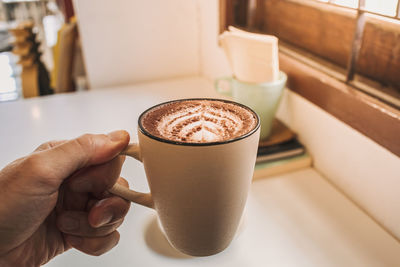 Midsection of coffee cup