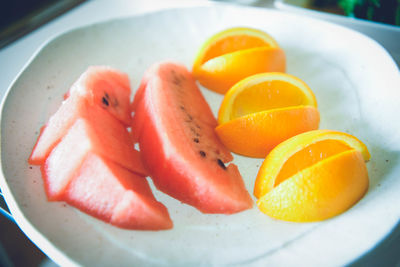 Close-up of orange slices in plate
