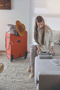 Young girl preparing the suitcases to go on a trip. concept of travel. selective focus