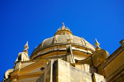 Low angle view of building against clear blue sky