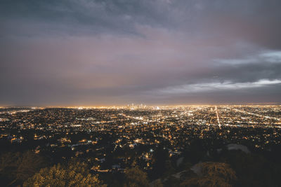 Beautiful wide view over all of los angeles at night with city lights glowing in the distance