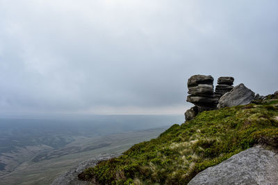 Rock formations on mountain against sky