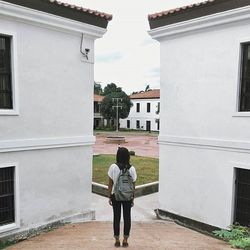 Woman standing in front of building