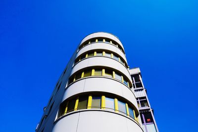 Low angle view of building against clear blue sky