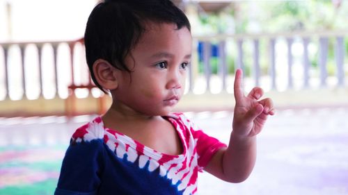 Portrait of cute boy looking away