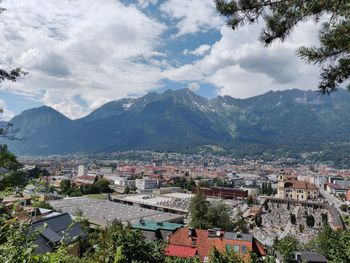 High angle view of townscape and mountains against sky