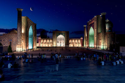 Illuminated buildings in city at night