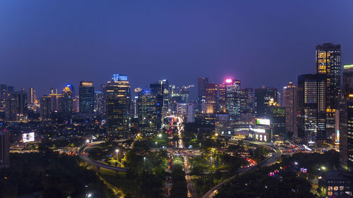 Illuminated buildings in city at night