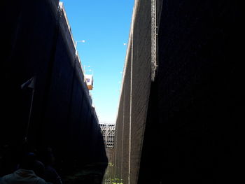 Low angle view of buildings against clear blue sky