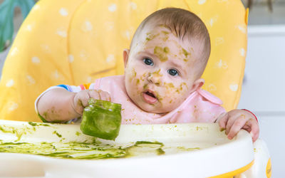 Close-up of cute boy eating food