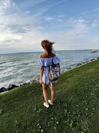 Rear view of man standing on beach