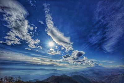 Low angle view of mountains against blue sky