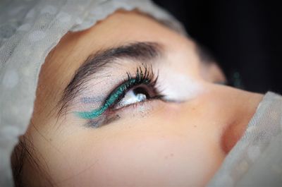 Close-up of teenage girl looking away