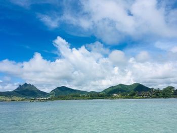 Scenic view of sea against blue sky