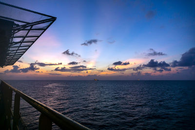 Sunset scenery of oil field viewed from a construction work barge 